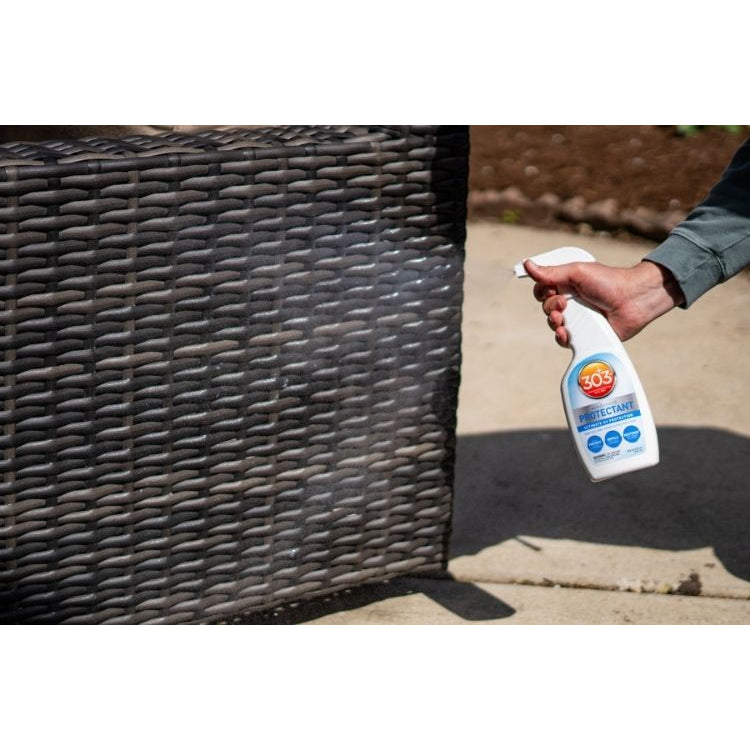 Applying 303 Aerospace Protectant to wicker furniture