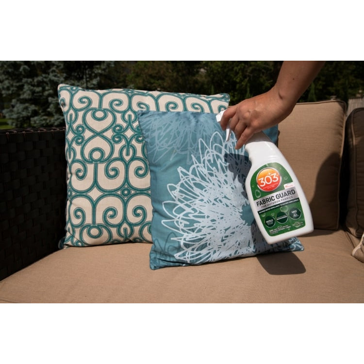 Spraying 303 Fabric Guard on outdoor pillow