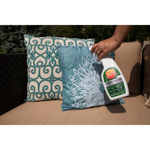 Spraying 303 Fabric Guard on outdoor pillow